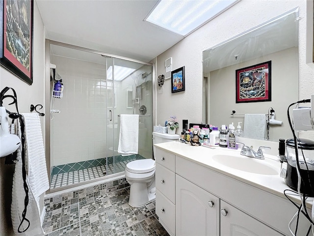 bathroom with vanity, toilet, and walk in shower