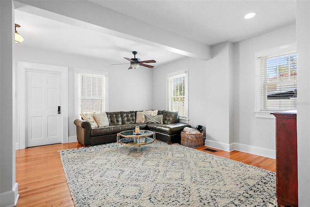 living room with beam ceiling, recessed lighting, ceiling fan, wood finished floors, and baseboards