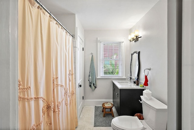 full bath featuring toilet, baseboards, and vanity