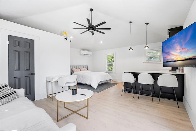 bedroom with lofted ceiling, light wood-type flooring, indoor bar, and a wall mounted air conditioner