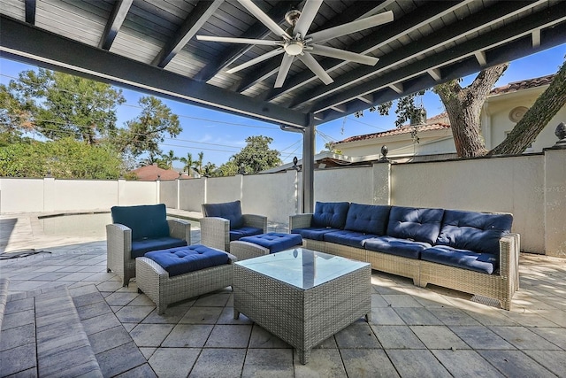 view of patio with a fenced backyard, ceiling fan, and an outdoor hangout area