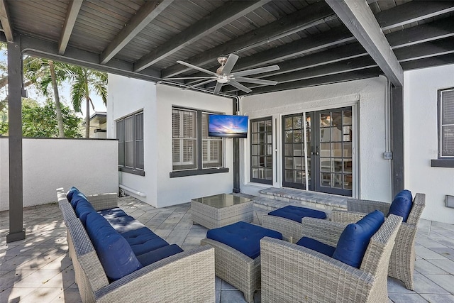 view of patio with a ceiling fan, fence, and an outdoor hangout area