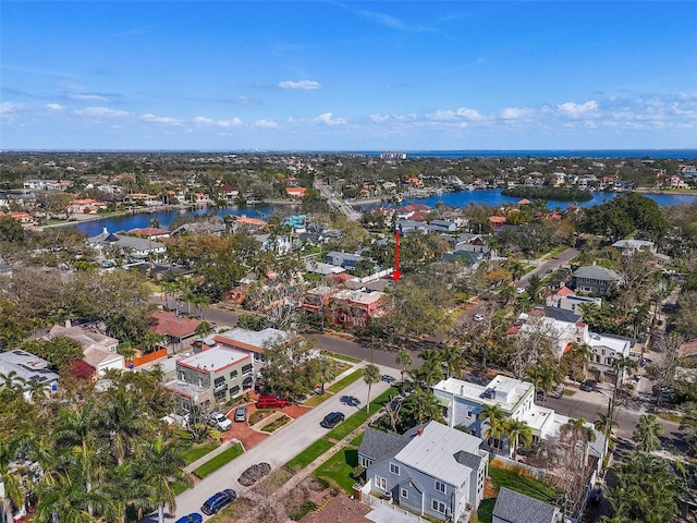 bird's eye view featuring a water view and a residential view