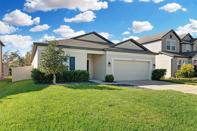 view of front of home featuring a front yard and a garage