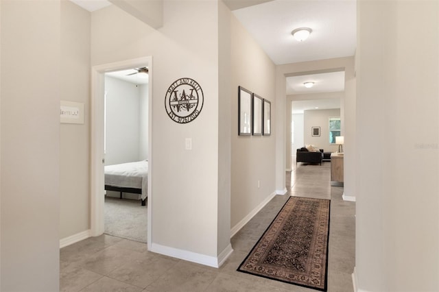 corridor with light tile patterned floors