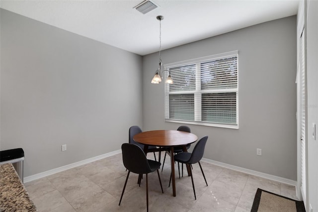 dining area with a chandelier