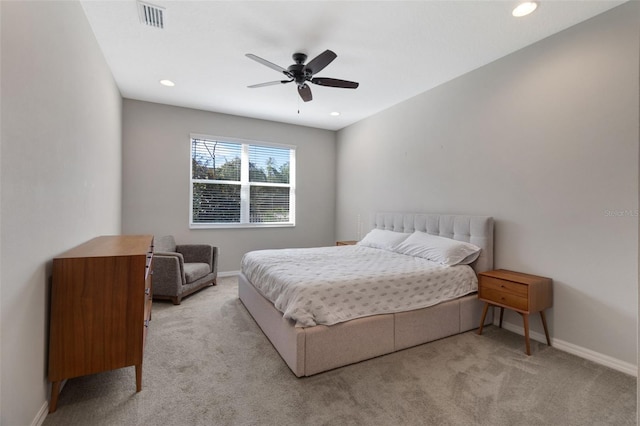 bedroom featuring ceiling fan and light colored carpet