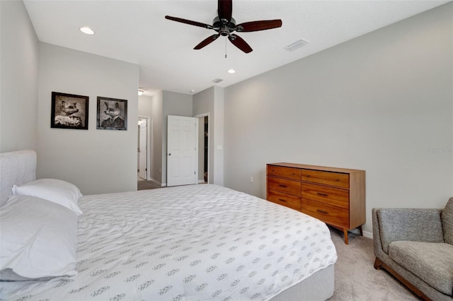 bedroom featuring light colored carpet and ceiling fan