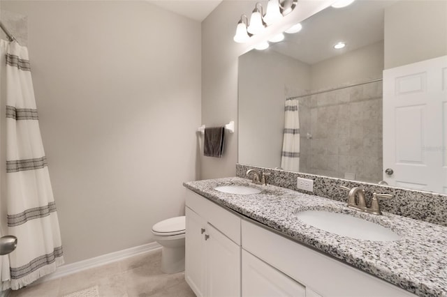 bathroom with toilet, curtained shower, vanity, and tile patterned flooring