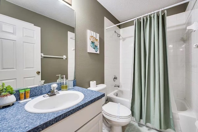 full bathroom with vanity, shower / bath combo, a textured ceiling, and toilet