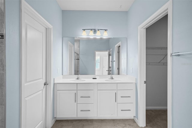 bathroom with tile patterned flooring and vanity