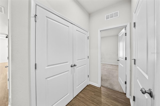 hall with dark hardwood / wood-style floors