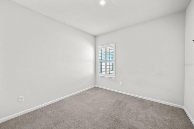 unfurnished room featuring carpet flooring