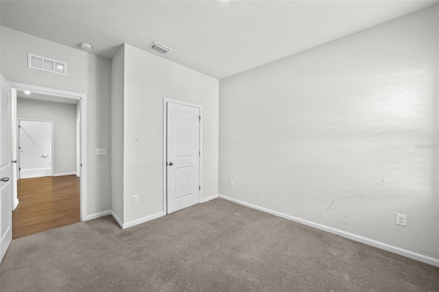 unfurnished bedroom featuring carpet flooring