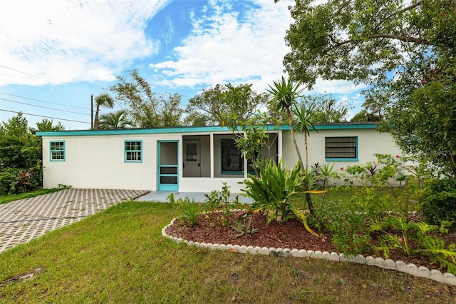 ranch-style home with a front yard