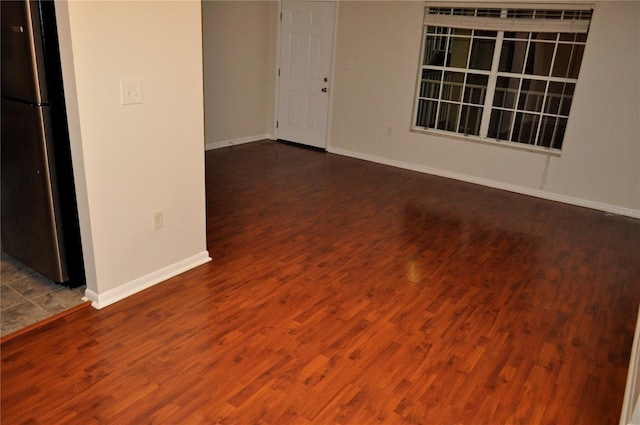 empty room featuring dark hardwood / wood-style floors