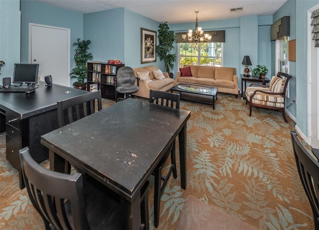 dining area featuring a textured ceiling and a notable chandelier