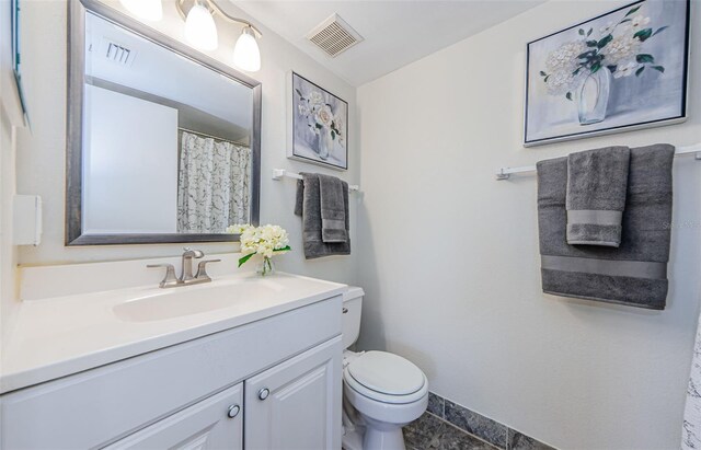 2690 Coral Landings Blvd Unit 722, Palm Harbor, FL 34684 - bathroom featuring toilet and vanity