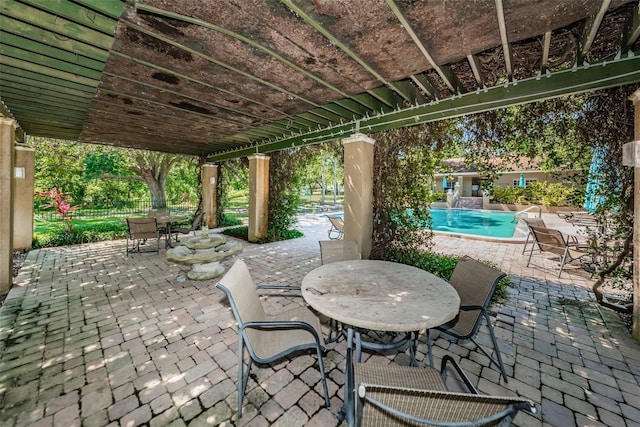 2690 Coral Landings Blvd Unit 722, Palm Harbor, FL 34684 - view of patio / terrace featuring outdoor dining space and a community pool