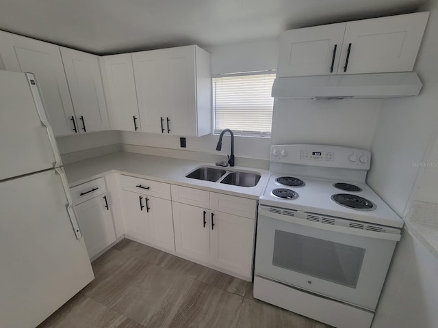 kitchen with white cabinets, sink, and white appliances