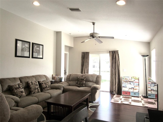 living room featuring ceiling fan, vaulted ceiling, and hardwood / wood-style flooring