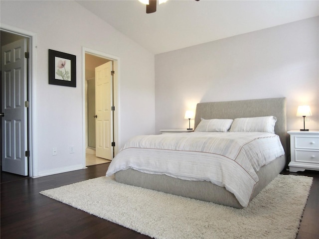 bedroom with ceiling fan, dark hardwood / wood-style flooring, and lofted ceiling