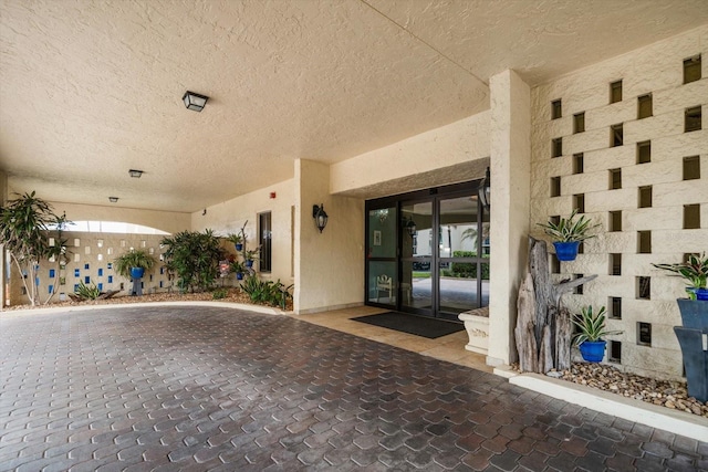 property entrance with french doors and a patio