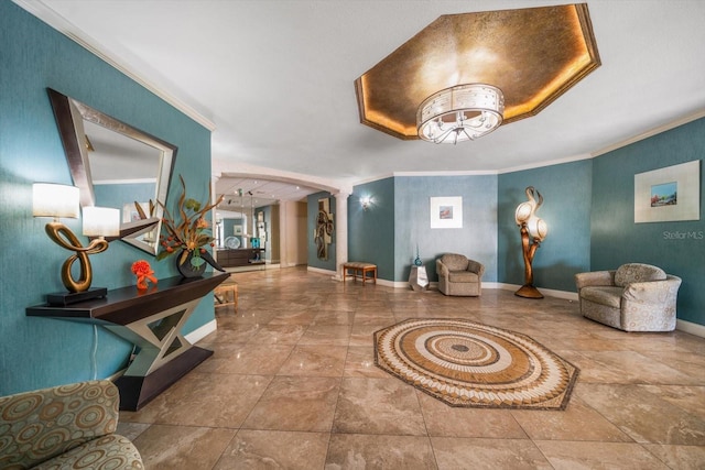 interior space featuring crown molding and decorative columns