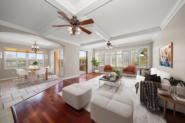 living room featuring hardwood / wood-style flooring, beamed ceiling, ceiling fan with notable chandelier, crown molding, and coffered ceiling