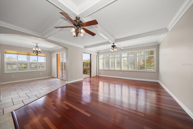 unfurnished living room with crown molding, wood-type flooring, and plenty of natural light