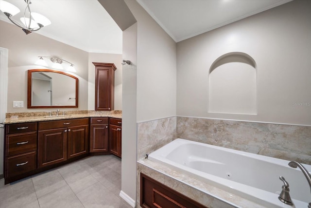 bathroom featuring vanity, crown molding, tile patterned floors, and a bathing tub