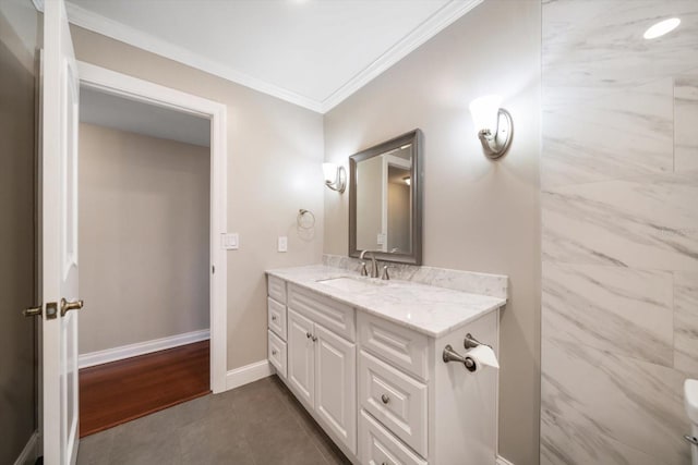 bathroom with vanity, ornamental molding, and hardwood / wood-style floors