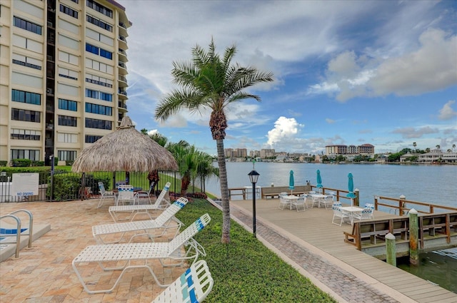 view of dock with a gazebo and a water view