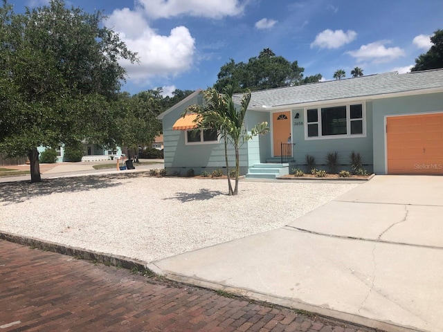 view of front of property with a garage