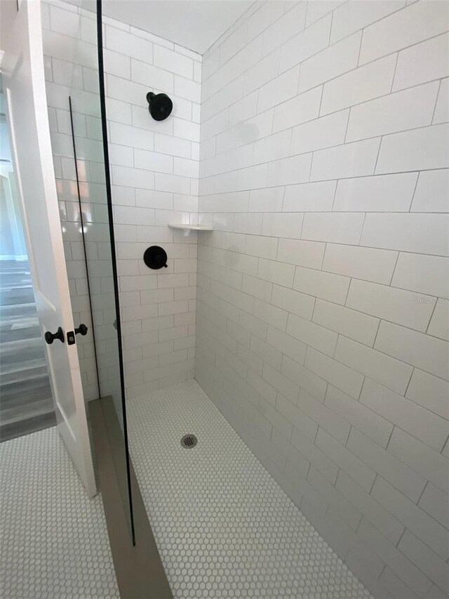 bathroom with a tile shower