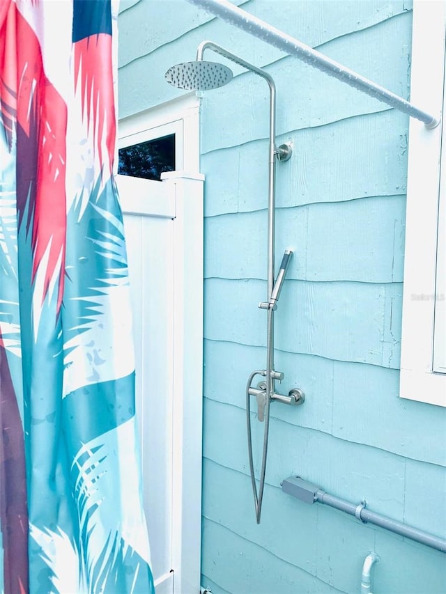 bathroom with a shower with curtain