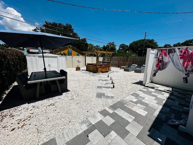 view of patio with a hot tub