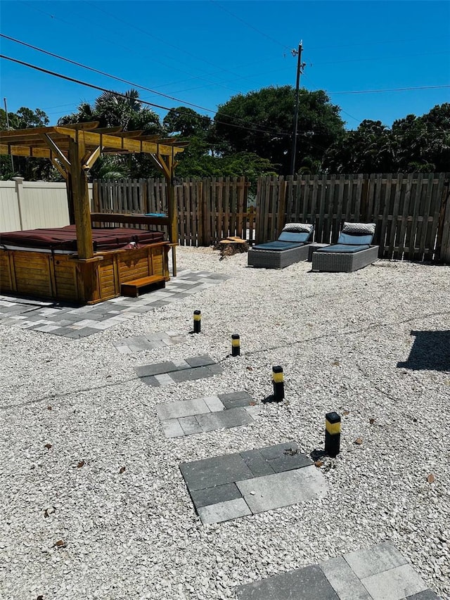 view of yard with a patio, a hot tub, and a gazebo