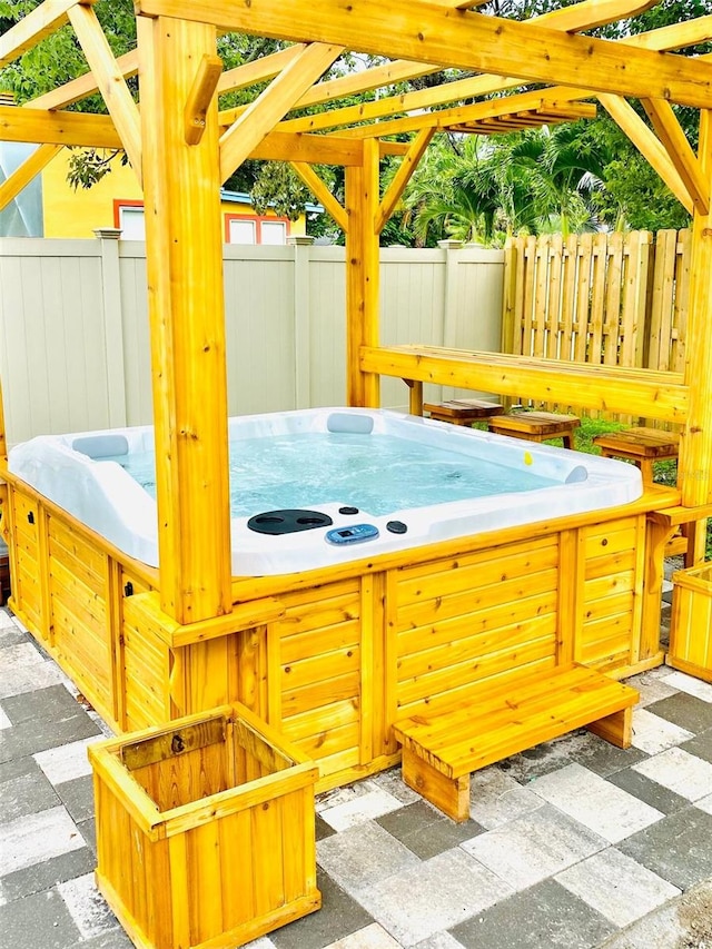 exterior space featuring a hot tub