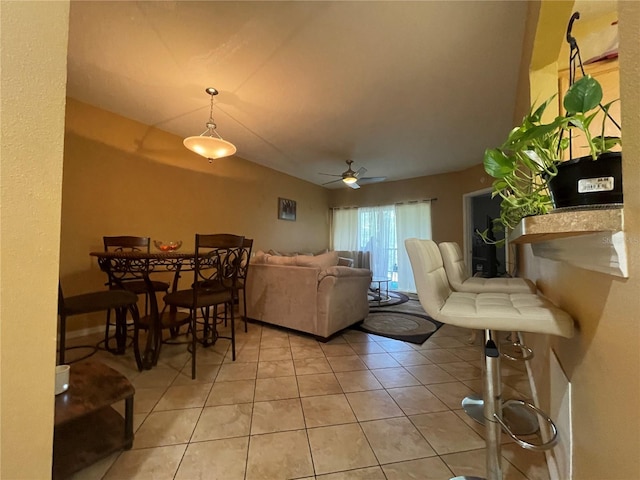 living room with light tile patterned floors and ceiling fan