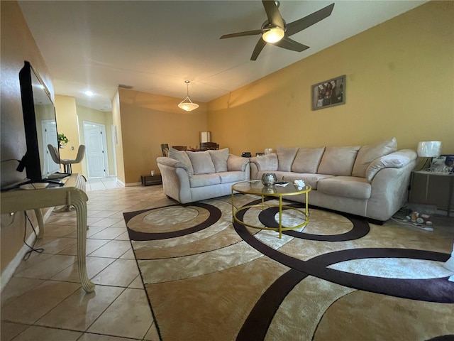 living room featuring light tile patterned flooring and ceiling fan