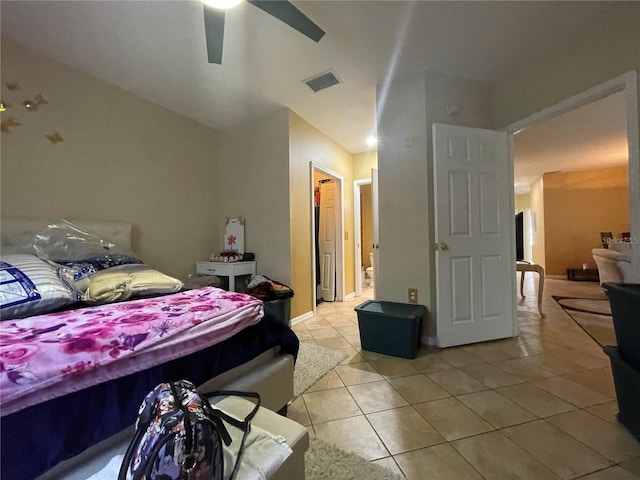 tiled bedroom with ceiling fan