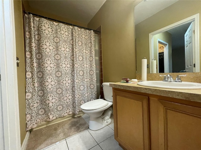 bathroom with vanity, toilet, a shower with curtain, and tile patterned flooring