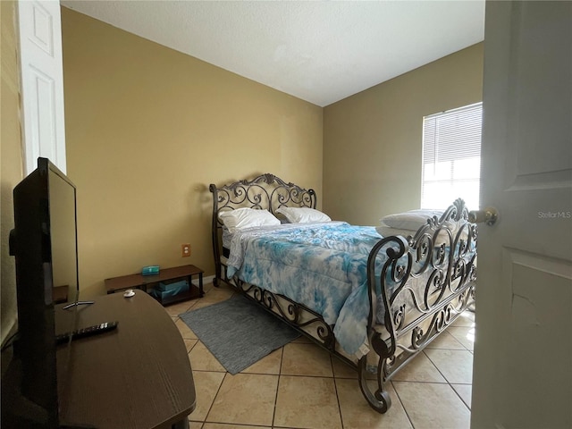 bedroom with light tile patterned flooring