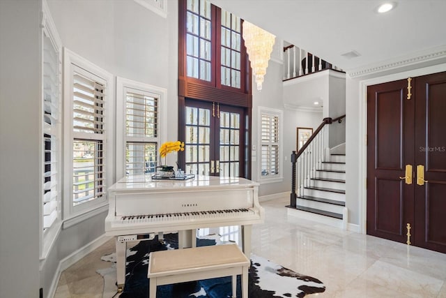 foyer entrance with marble finish floor, baseboards, french doors, and stairs