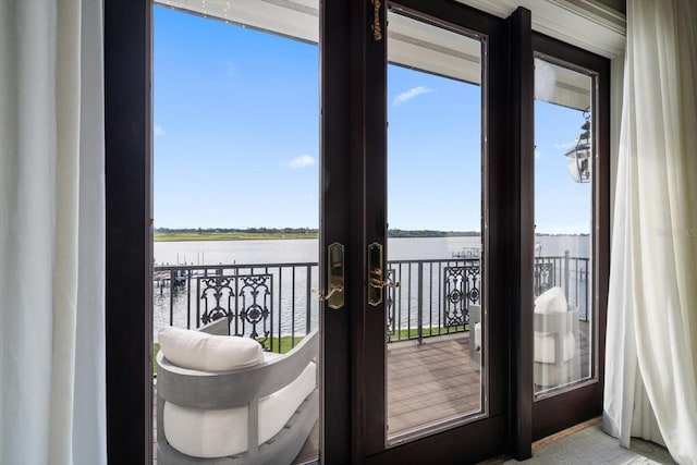 entryway with french doors and a water view