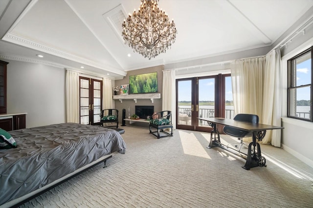 carpeted bedroom with access to exterior, french doors, a fireplace, and vaulted ceiling