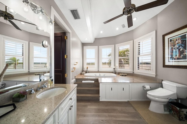 full bathroom with ceiling fan, toilet, recessed lighting, wood finished floors, and visible vents