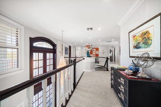 hall featuring visible vents, light colored carpet, ornamental molding, an upstairs landing, and recessed lighting