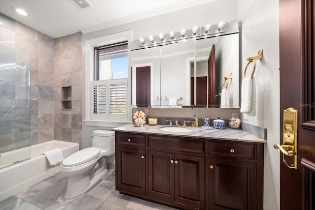 full bath featuring visible vents, toilet, shower / bath combination with glass door, crown molding, and vanity